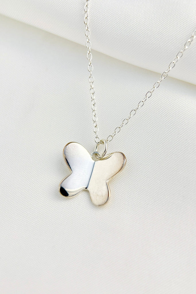 silver butterfly pendant necklace on a silver chain