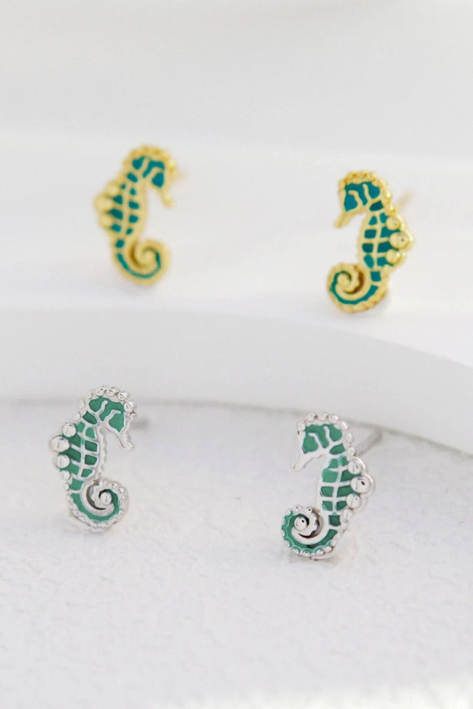 seahorse stud earrings made from s925 sterling silver, the earrings are turquoise with silver or gold plated silver