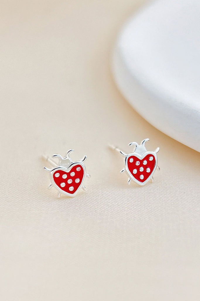 red and silver lady bird stud earrings shaped like a love heart