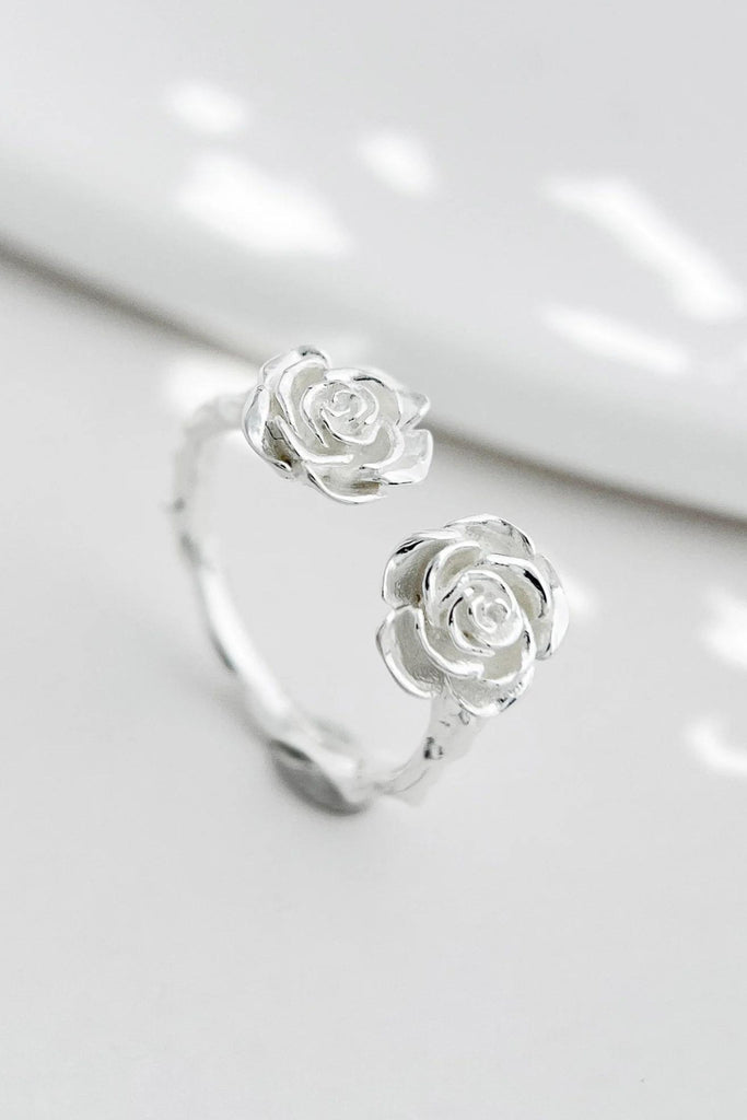 close up of the sterling silver ornate roses on the silver ring