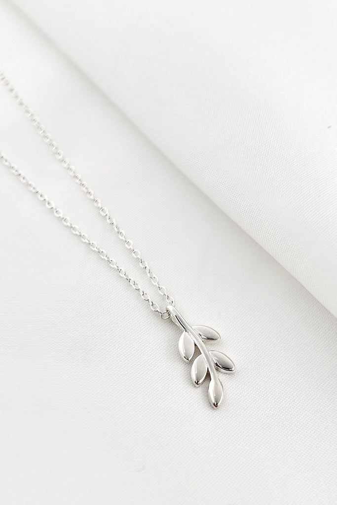 silver olive leaf pendant necklace with the olive leaf hanging vertically from a silver chain