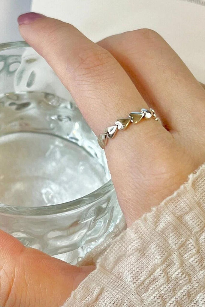 model wearing this love heart ring on the index finger