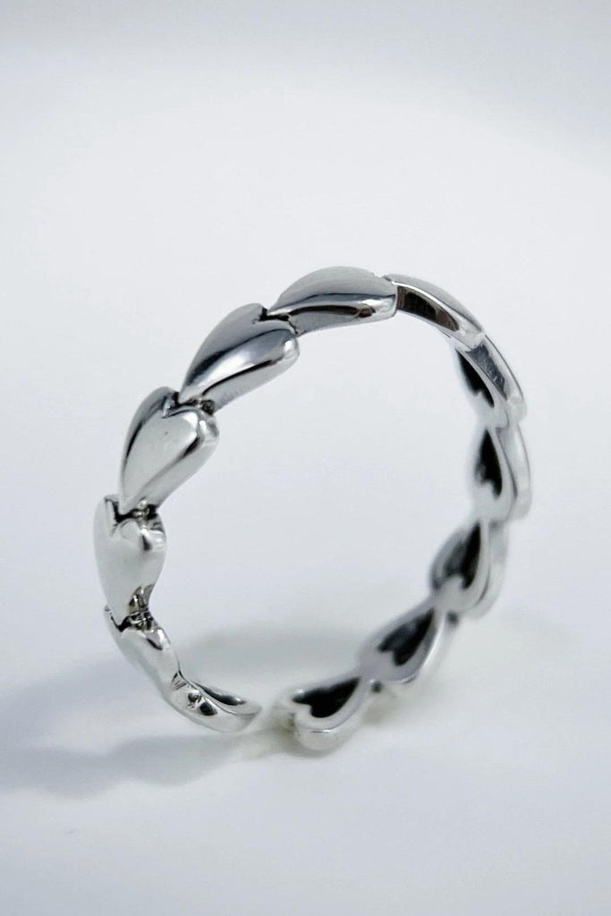 close up of the s925 sterling silver heart ring, showing the open band 