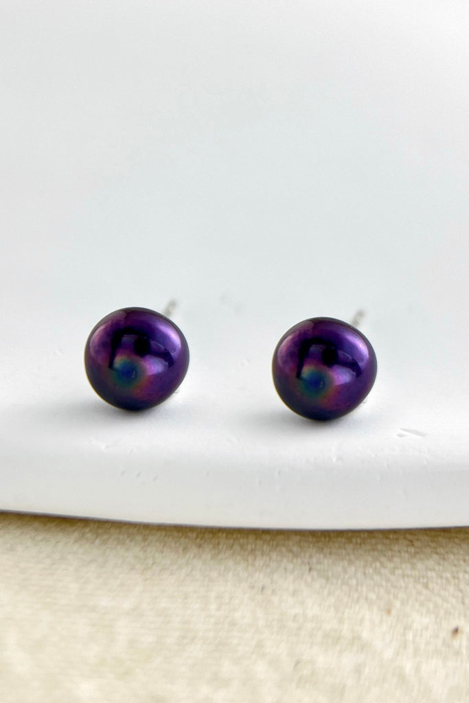 close up of the black freshwater pearls which look purple in the light