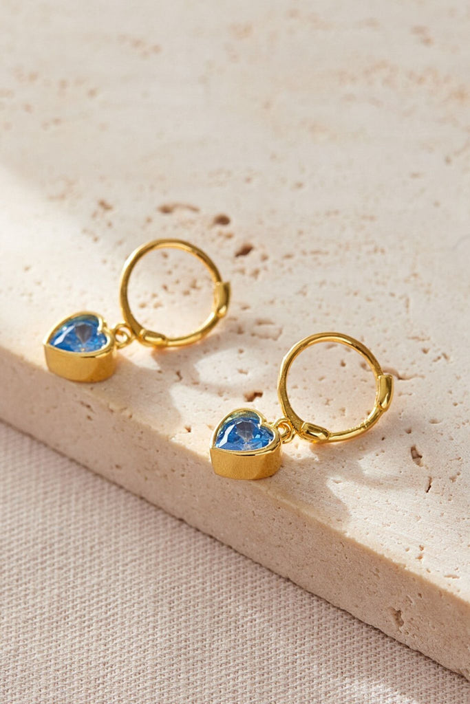 close up of the march birthstone option, light blue heart shaped cz crystal