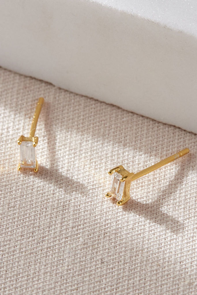 white and gold sterling silver baguette stud earrings