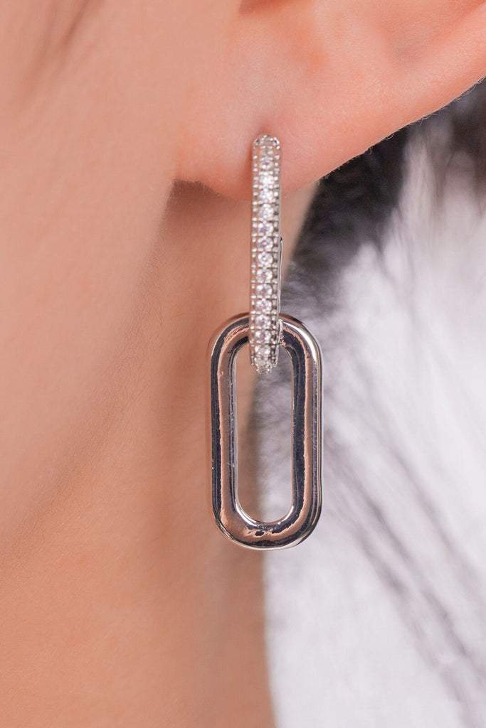 close up of the silver colourway of this sparkly link dangle hoop earring