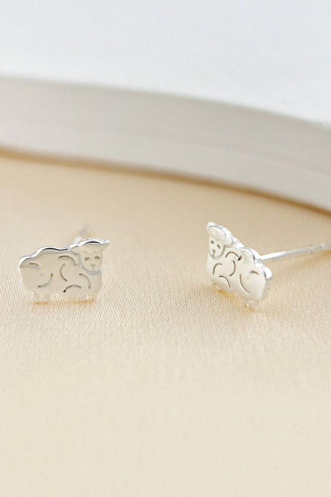 close up of the silver sheep stud earrings