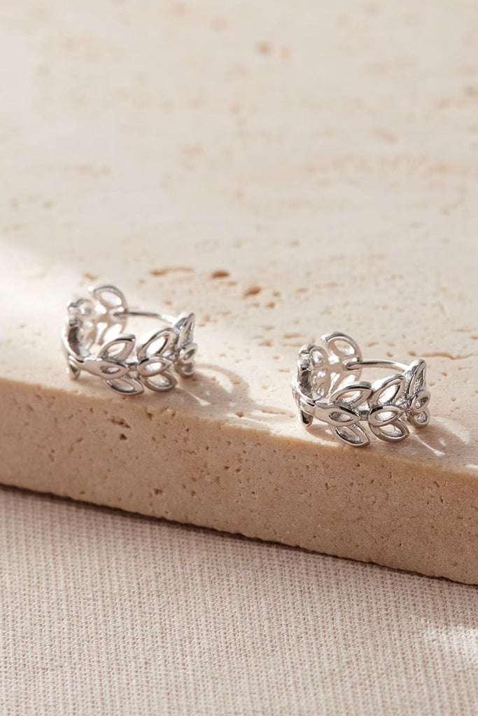 close up of the silver olive leaf hoops