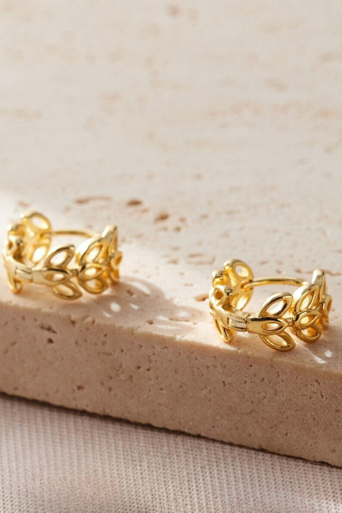 close up of the gold olive leaf hoops
