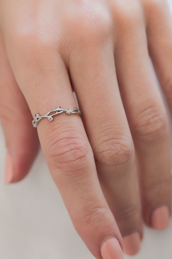 model wearing the silver branch ring on the index finger, showing the tree branch designs and cz crystal accents