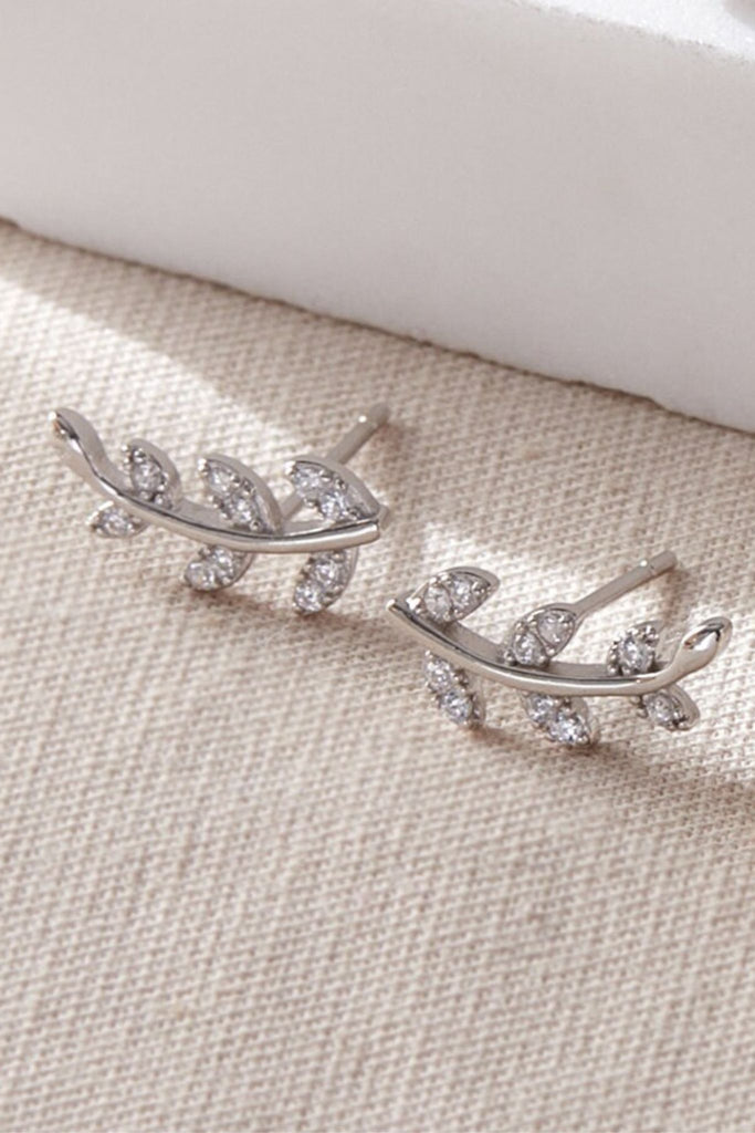 close up of the silver and white cz leaf stud earrings