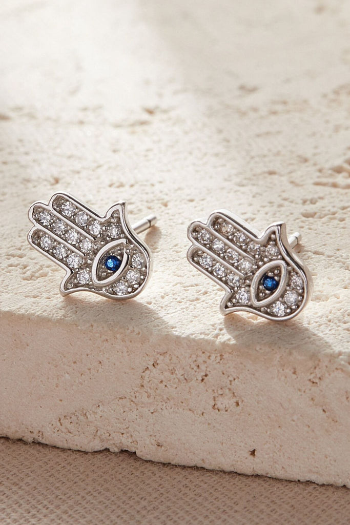 close up of the silver hamsa hand stud earrings