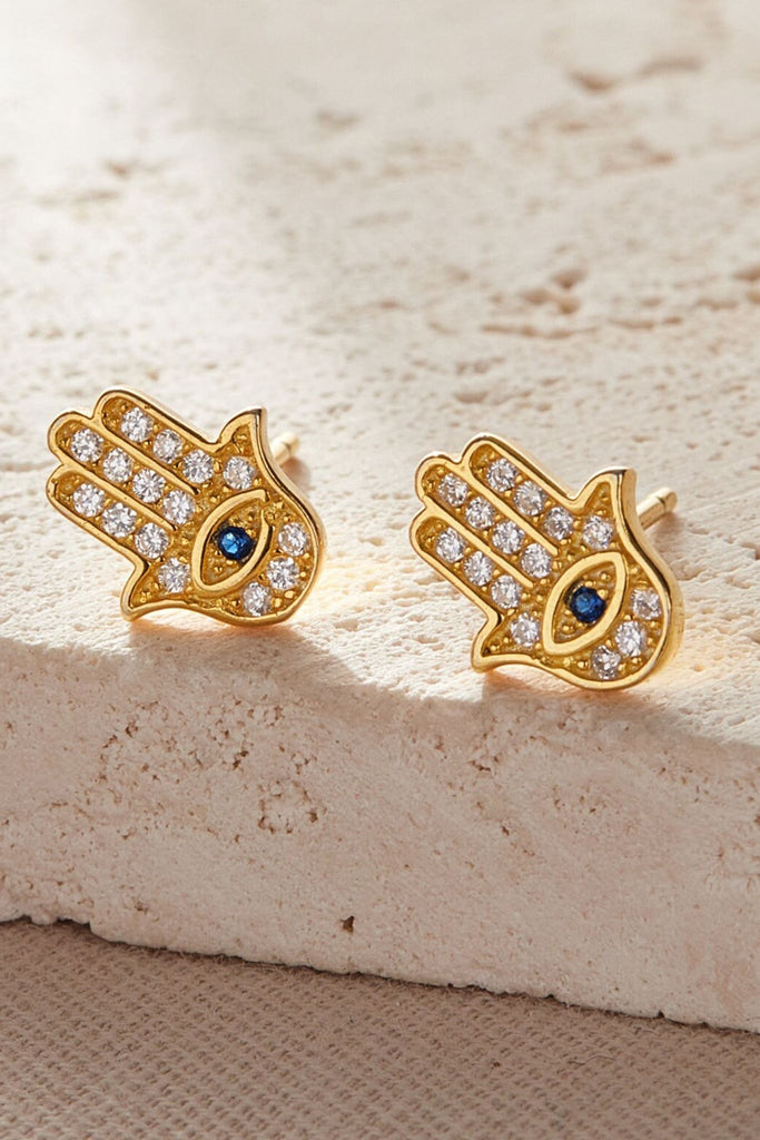 close up of the gold hamsa hand stud earrings