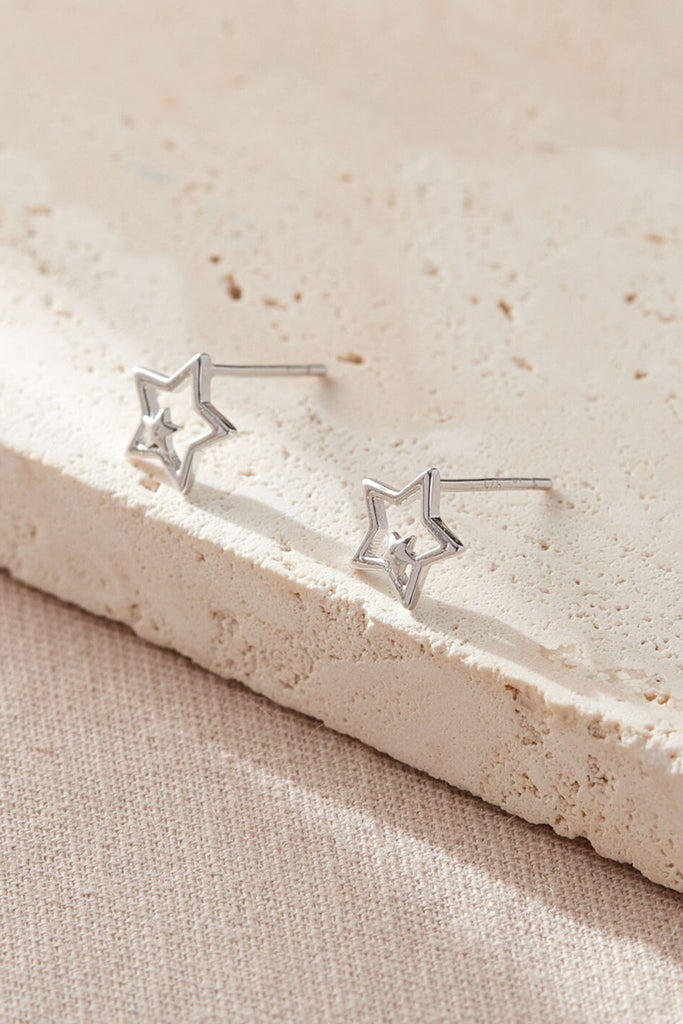 close up of the silver double star stud earrings