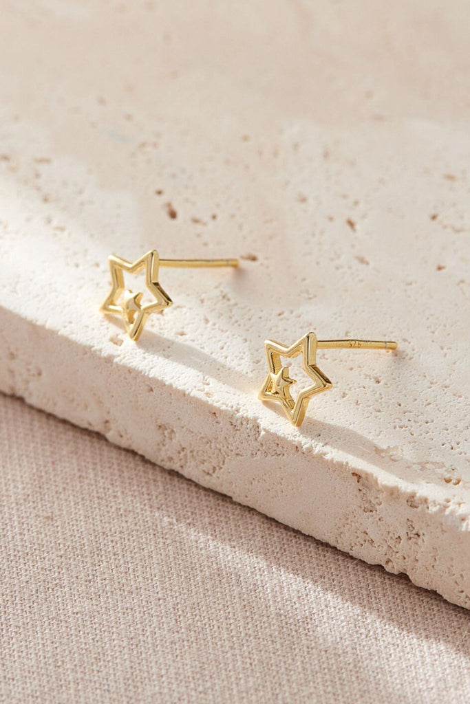 close up of the gold plated s925 silver double star stud earrings