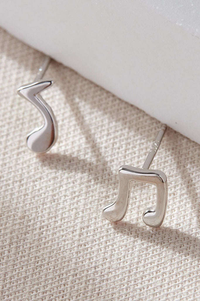 close up of the sterling silver musical note stud earrings