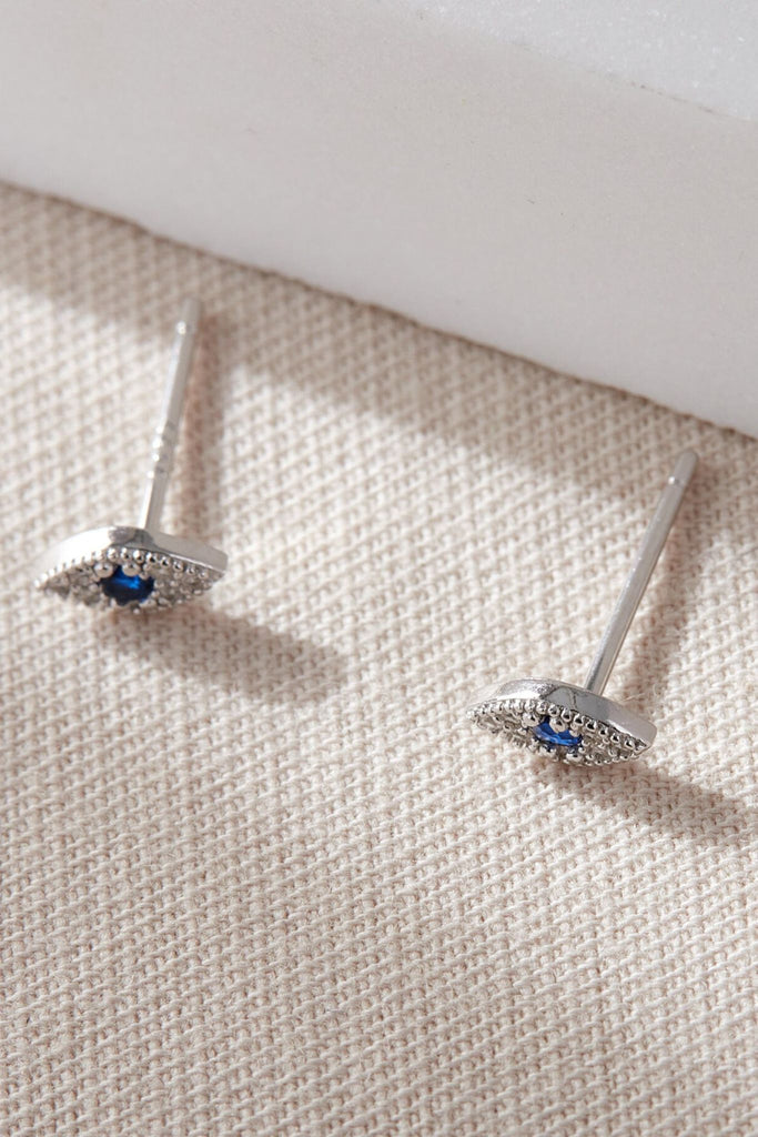  sterling silver and sparkly cz stud earrings shaped like and eye with a blue centre