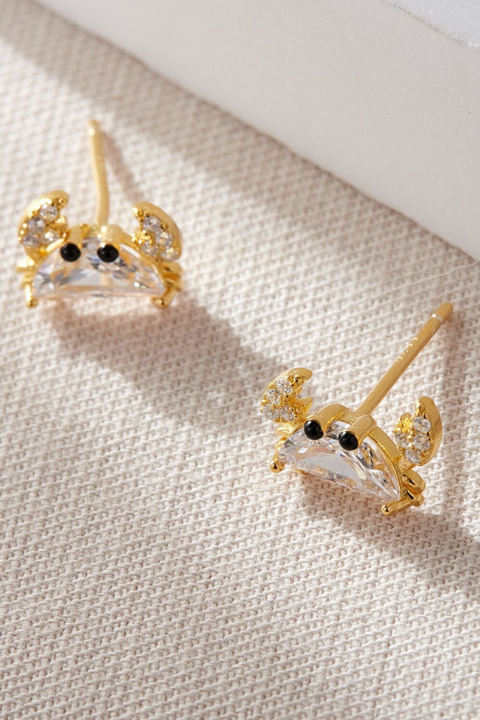close up of the gold plated silver sparkly crab stud earrings