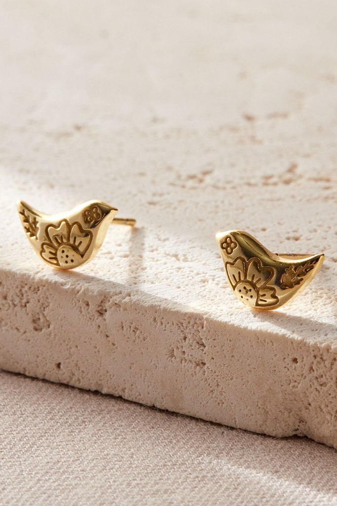 close up of the gold plated S925 sterling silver bird stud earrings