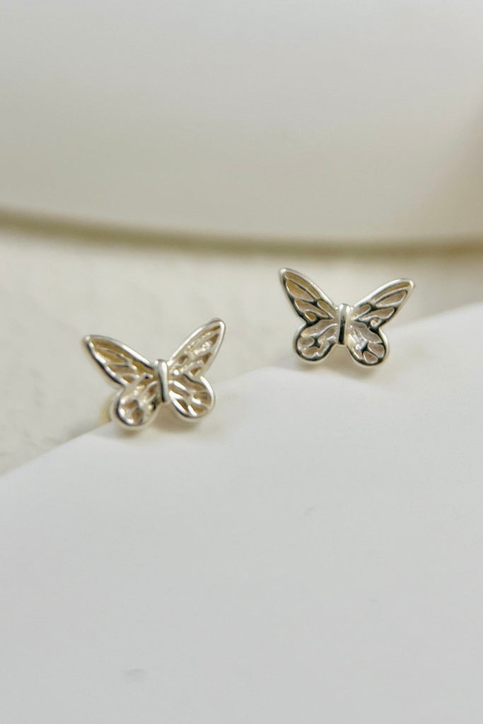 close up of the butterfly design on the studs, showing intricate detail on the wings of the studs