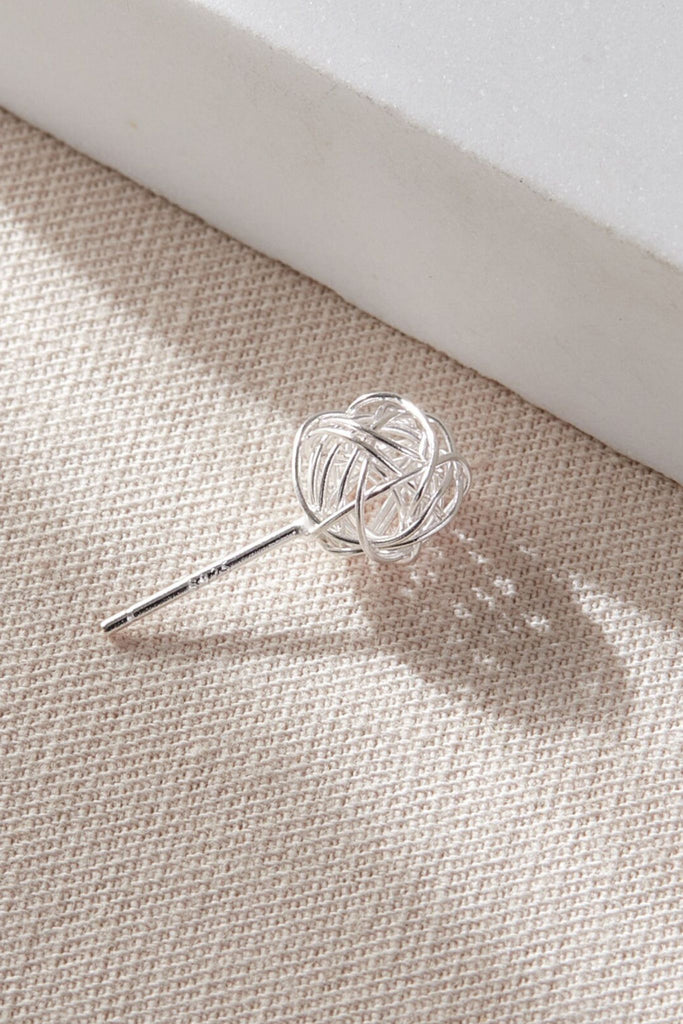 close up of the wireball stud earring, showing the S925 hallmark on the stem