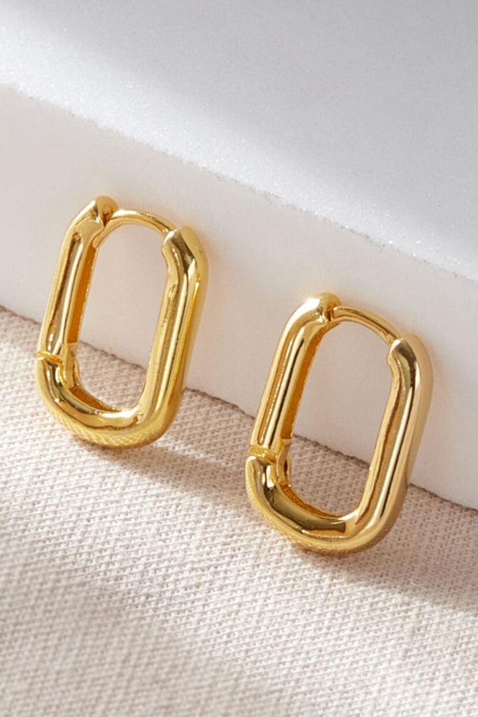 close up of the gold coloured S925 u-shaped hoop earrings