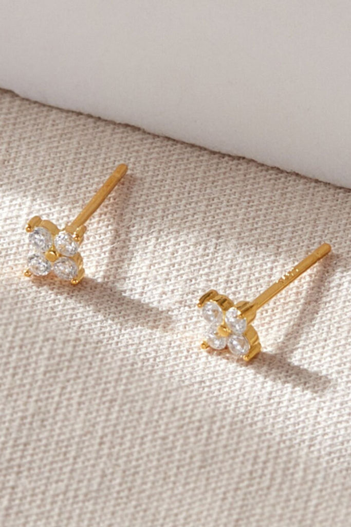 close up of the gold plated silver sparkly clover stud earrings