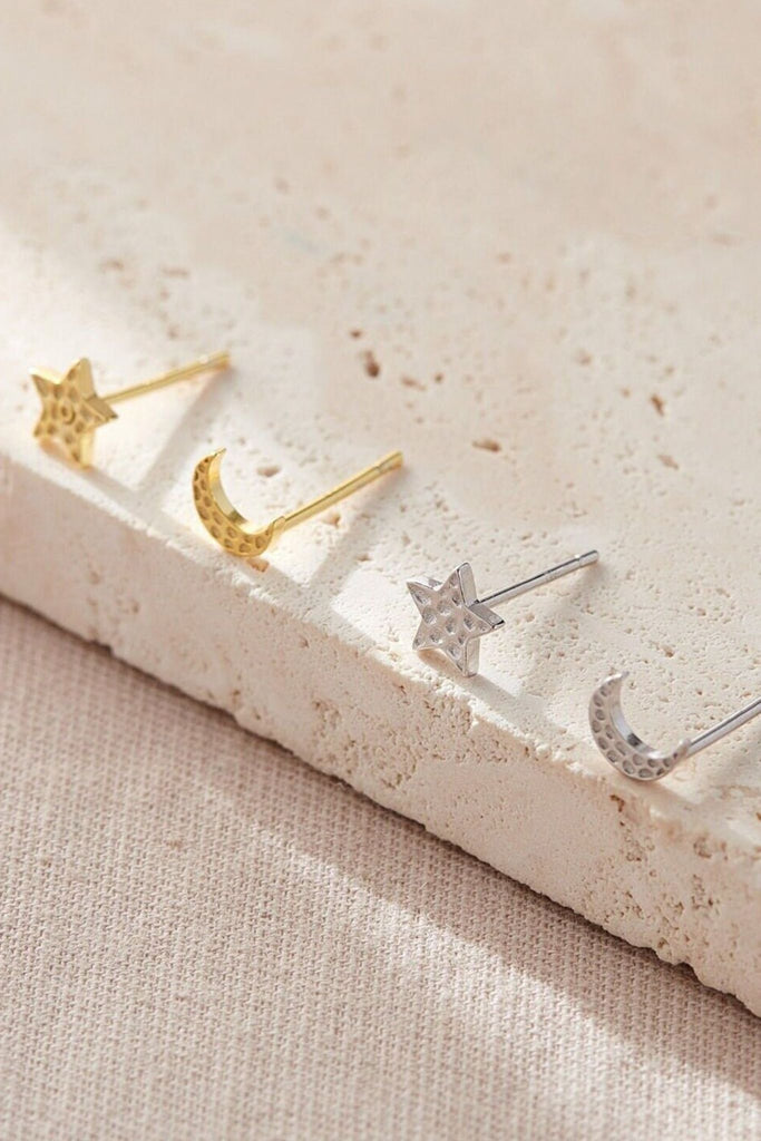 silver and gold hammered stud earrings, each pair consists of one star stud earring and one moon stud earring, available in silver and gold