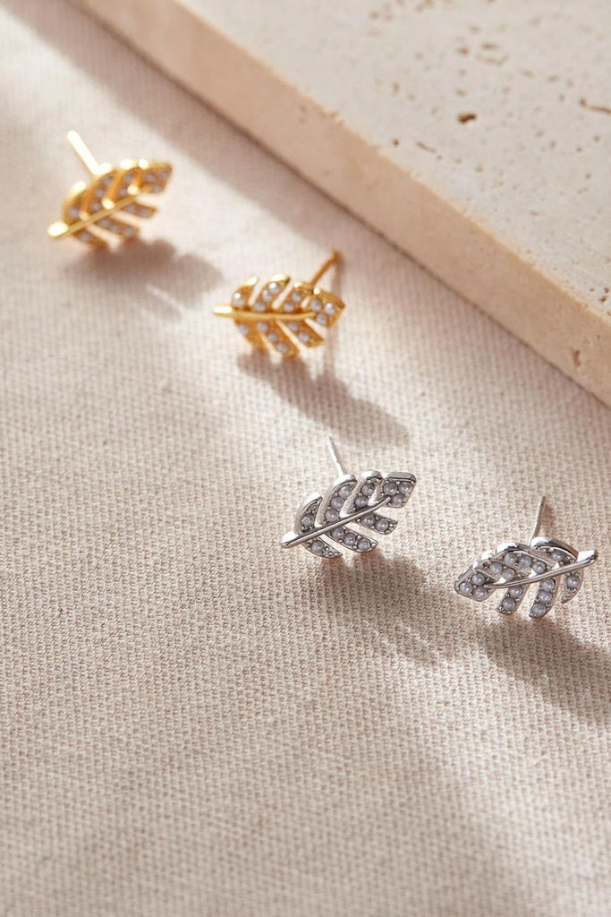 small leaf stud earring in sterling silver encrusted with tiny white cz crystals to give them a sparkly appearance, available in silver and gold