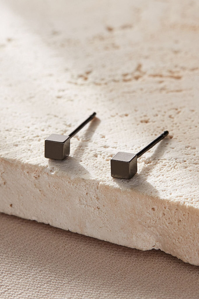 close up of the black square studs