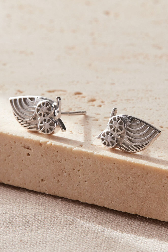 close up of the silver owl stud earrings
