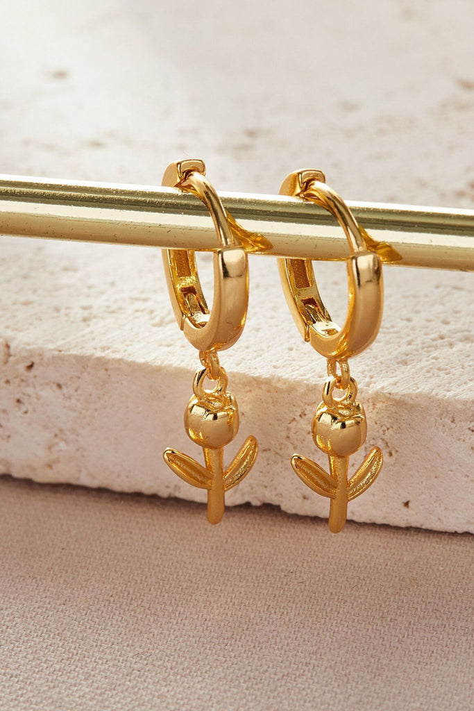 close up of the gold plated sterling silver tulip dangle hoop earrings