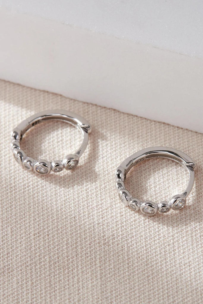 close up of the silver cz beaded huggie hoop earrings