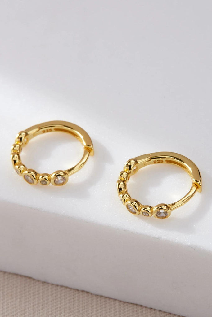 close up of the gold plated silver cz beaded huggie hoop earrings