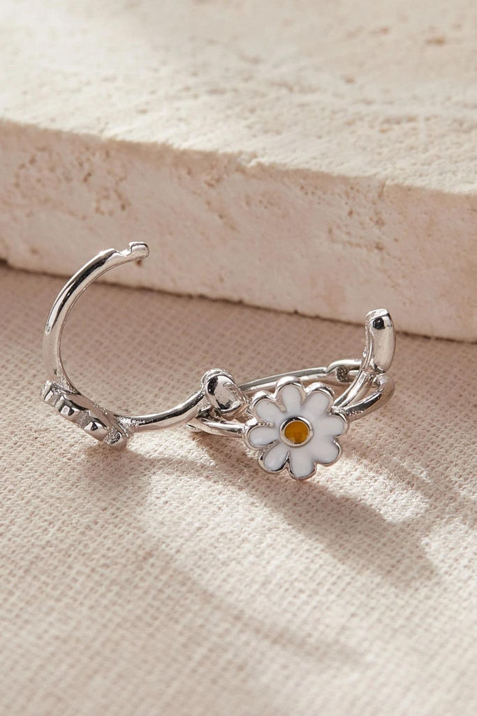 close up image of the latch closure fastening on the daisy hoops