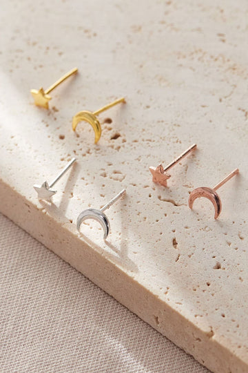 mismatched asymmetric star and moon stud earrings in silver, gold and rose gold. all made from s925 sterling silver