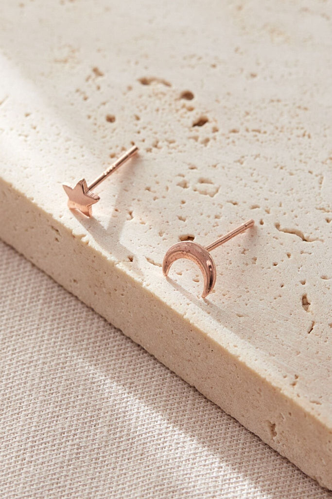close up of the rose gold plated sterling silver star and moon stud earrings