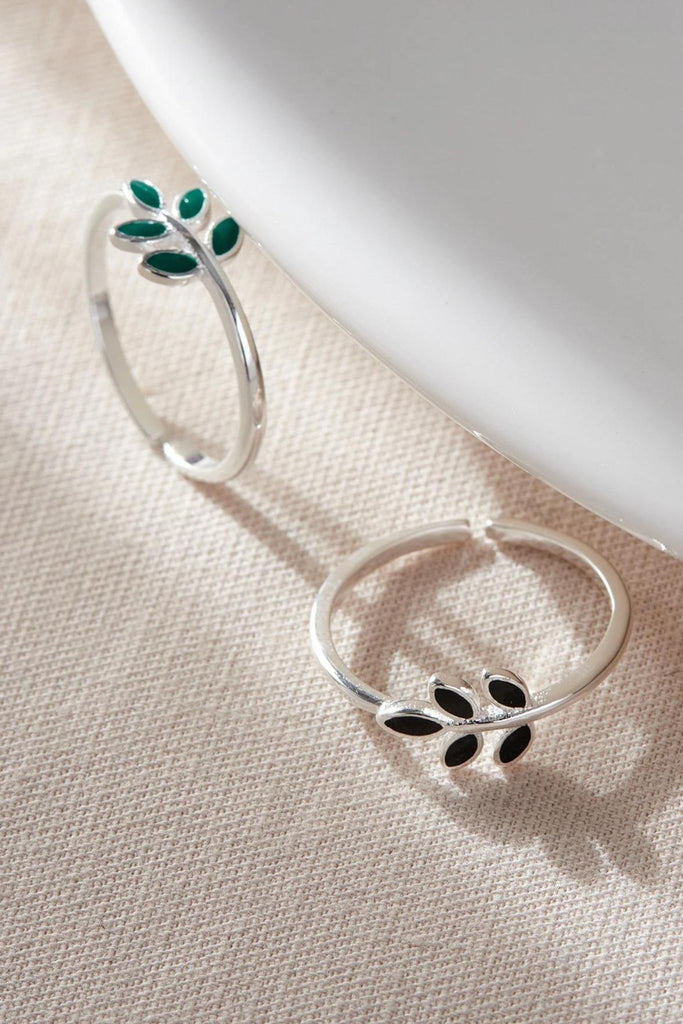 silver open band rings with olive leaf detail in the middle, the olive leaves come in a choice of green or black