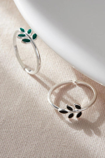 silver open band rings with olive leaf detail in the middle, the olive leaves come in a choice of green or black