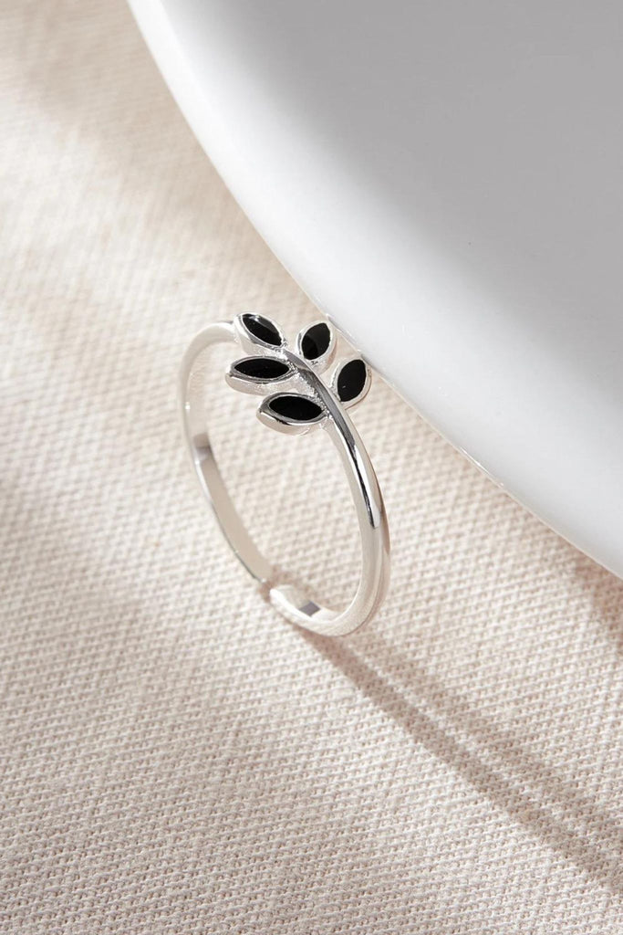close up of the black olive leaf silver ring