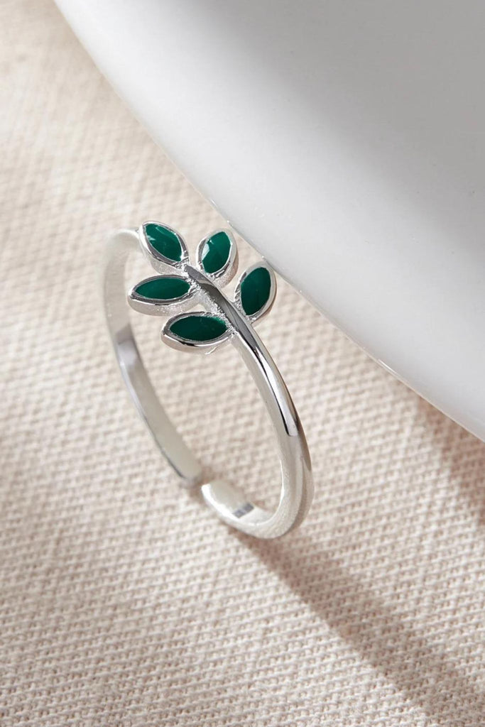 close up of the green olive leaf silver ring
