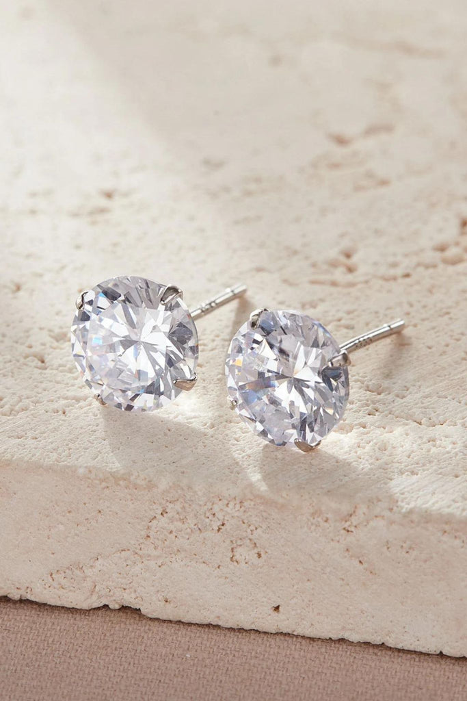 close up of the white sparkly round crystal stud earrings