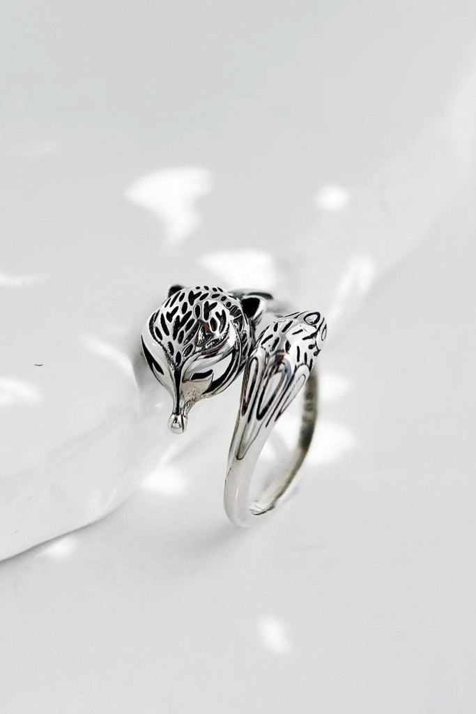 sterling silver ring, designed with a foxes head and tail which wraps around the finger, the ring is adjustable