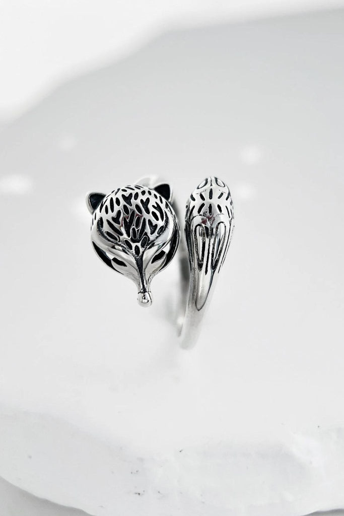 view from above the ring, showing clearly the fox face and tail details which make up each end of the silver ring