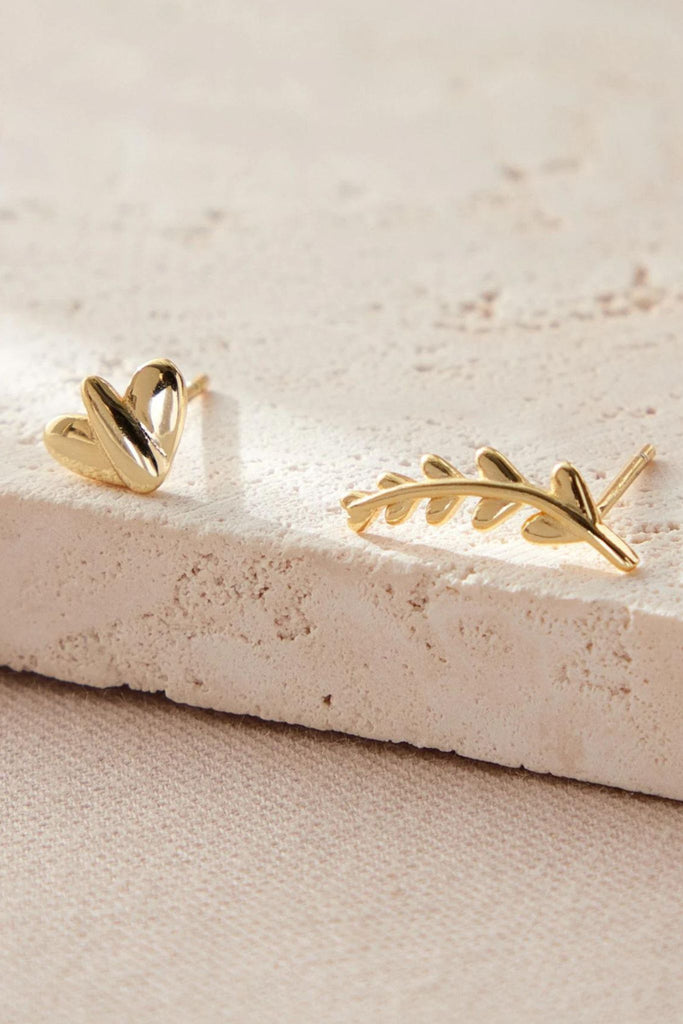 close up of the gold plated s925 sterling silver mismatched leaf and branch earrings