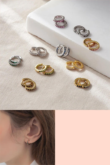 small huggie hoop earrings in silver and gold plated sterling silver, this image shows the variety of colourful cz stones available for each style, green, red, blue, white, rainbow and black