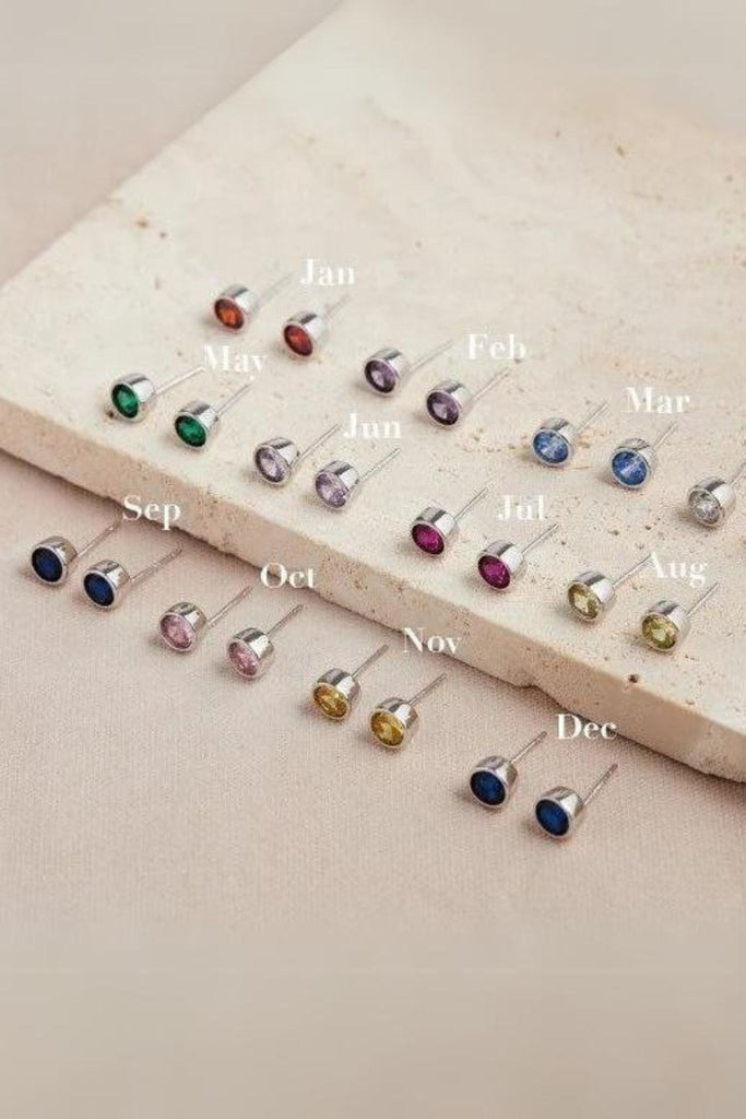 twelve colourways of round cz stud earrings, each representing each month of the year