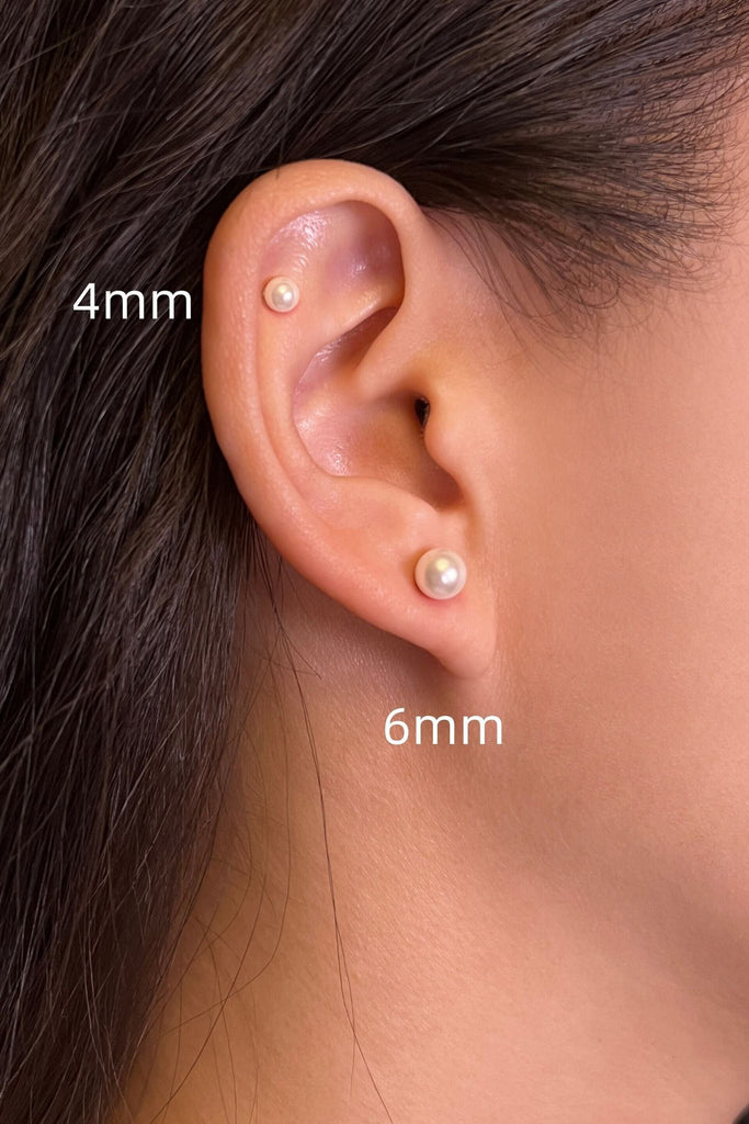 model wearing both the 4mm and 6mm pearl cartilage stud earrings, showing that they can be worn as cartilage studs and in the earlobe 