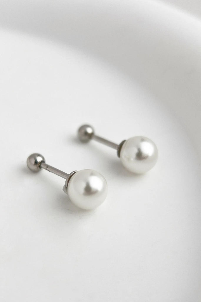 a pair of ball back screw fastening faux pearl stud earrings